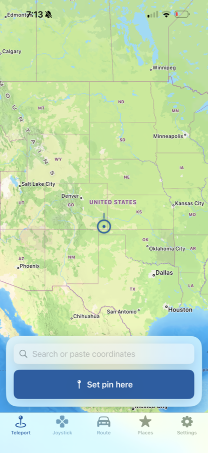 Wander Teleport screen on iPhone — search or paste coordinates, set your pin